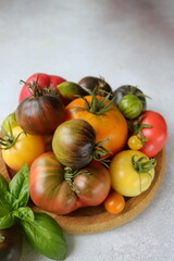 beautiful organic tomatoes of different shades and shapes close-up
