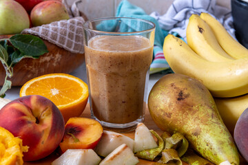 A glass of smoothie made with fresh fruits. Healthy living, lifestyle concept.