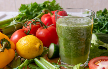A glass of smoothie made with a blend of healthy raw vegetables. Healthy lifestyle and living concept.