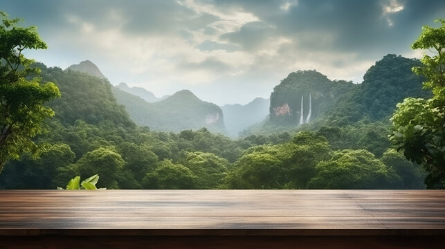 Empty wooden table top with mountain foggy jungle landscape with waterfall. Fog and clouds mountain tropical valley landscape, for display or montage your products.