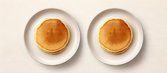 Two folded pancakes on a white plate photographed separately isolated pastel background Copy space