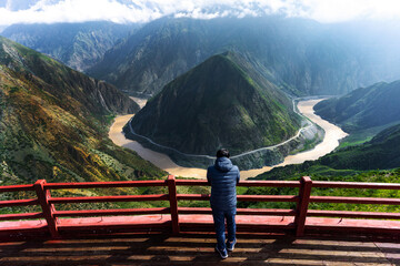 Scenic of man and Great bend of Jinsha River Yunnan, China. Jinsha river is the upper reach of the Yangtze River. - obrazy, fototapety, plakaty