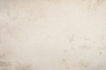 Obraz premium aged concrete wall with a close-up shot, featuring a vintage, plain cream-colored cement wall background texture.retro charm reminiscent of antique parchment paper.