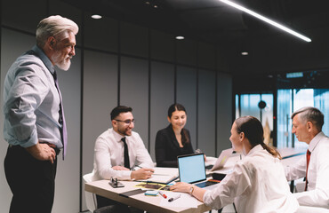 Businesspeople discussing business project together