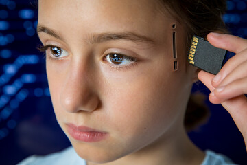 Teenage girl plugging SD memory card into slot in her head. Artificial intelligence, technological and computer dependence, robotics, memory upgrade, mind control, computing