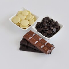 Handmade Chocolate Bars Composition on Light Background