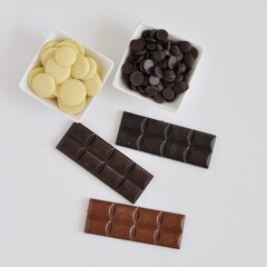 Handmade Chocolate Bars Composition on Light Background