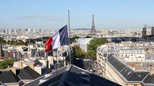 Aerial view of the Eiffel tower over the French flag in Paris, France