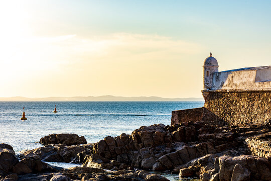 Saint Mary fort on the seafront of the city of Salvador in Bahia during sunset - Powered by Adobe