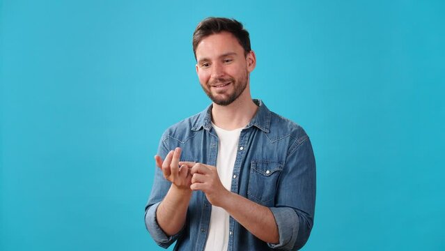 Pensive bearded man bends fingers counting things dreamily