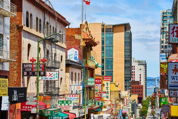 Chinatown street view of shop signs leading down street toward San Francisco Bay © Nicholas J. Klein