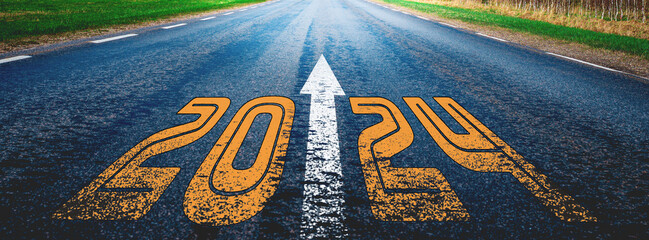 Obrazy na Plexi  Banner.New year 2024 written on highway.future,work start run line vision concept.Nature landscape road happy new year celebration in the beginning of 2024 for fresh and successful start.