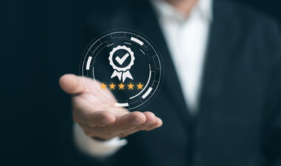 Businessman's hand showing symbolic icon of top service. Quality Assurance, Guarantees, standards, ISO certification and standard concepts, satisfaction, and service experiences.
