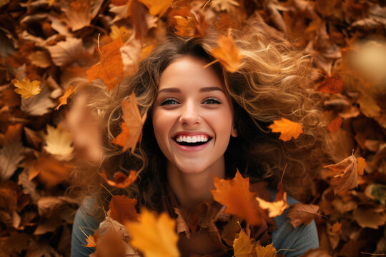 Happy Woman Under Autumn Leaves