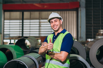 Engineers Inspecting Machinery at Metal Sheet Factory. Foreman inspecting and check up machine. Industrial of metal roof roll sheet.