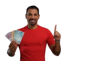 A man with Brazilian money in his hand points upwards with his finger to an empty space on the right-hand side of the image, wearing a red T-shirt, 