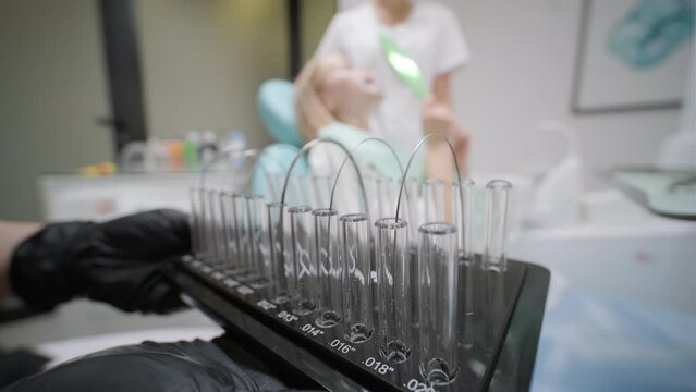 Ceramic braces for installing construction on teeth in plastic packaging.