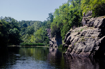 a river in the middle of a beautiful canyon