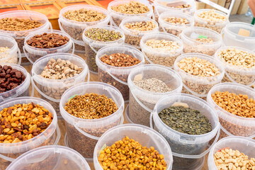 Delightful assortment of fresh, roasted, and candied nuts at the vibrant local market.