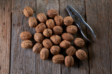 Walnuts on rustic wooden table