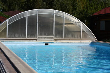 covered outdoor pool, blue water effect