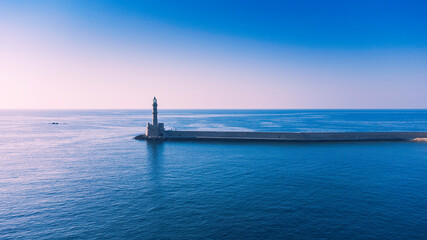 Old lighthouse building at Chania, Greece. Famous travel tourism landmark. Aerial top down drone view. - 650829757