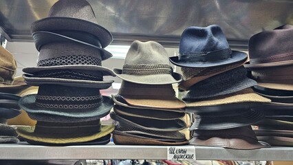 Men's felt hats on the counter of an old things store.