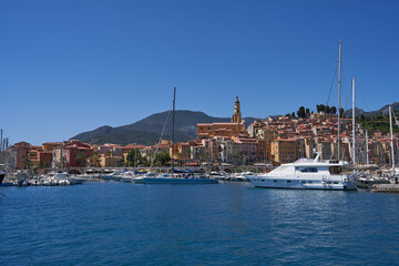 Fototapeta na wymiar Menton, France - August 8, 2023 - View on old part of Menton on a beautiful summer day 