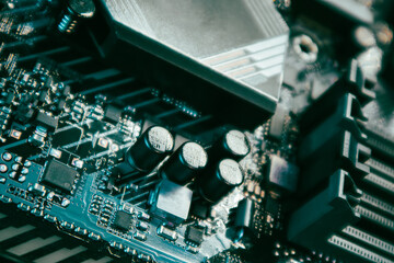 Motherboard with sockets and resistors close-up on modern powerful desktop PC. Computer hardware...