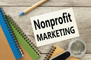 Nonprofit Marketing page from notepad with text. magnifier notepad