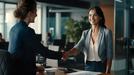 Successful Business Deal: Happy Mid-Aged Businesswoman Handshaking with Client in Office, Job Interview