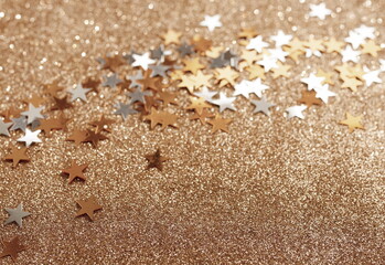 Abstract gold stars sparkle background template banner . Copy space.Christmas blur glitter bokeh gold beige festive backdrop.