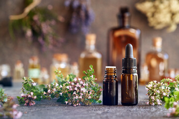 Bottles of oregano essential oil on a table