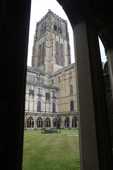 Durham, UK - 12 July, 2023: Cloisters and interior lawn of Durham Cathdral, England