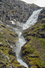 waterfall along the narrow mountain road at the Trollstigen