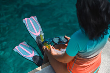 beautiful young woman enjoys snorkeling in the indian ocean. active holiday in the Maldives.