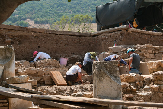 archeologists digging working in ephesus ruins