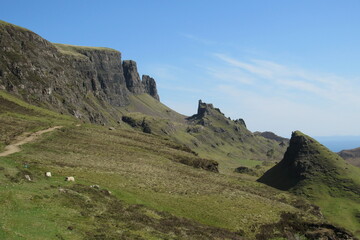Fototapeta na wymiar Isle of Skye island against a blue sky in Scotland