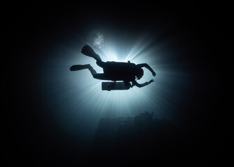silhouette of diver