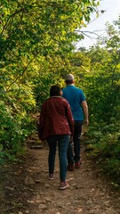 Elderly couple strolling through a forest together, illuminated by the vibrant morning sun