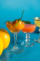 The citrus cocktails on blue background