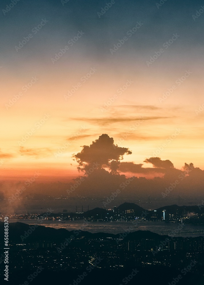 Wall mural stunning aerial view of a city skyline during a spectacular sunset.