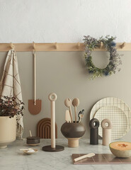 Wooden and ceramic design utensils in kitchen interior