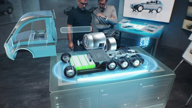 Two male automotive engineers create new eco-friendly truck with electric engine using futuristic virtual reality holographic model. 3D computer graphics of modern vehicle developing. VFX animation.