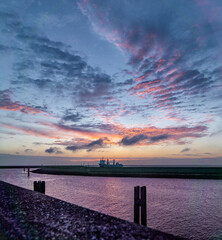 Beautiful view of river with a ship during sunset