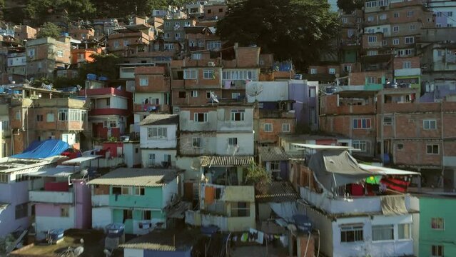 Aerial rising past favela houses in Rio de Janeiro, Brazil