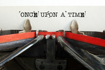 Once upon a time the text is typed on a vintage typewriter with black ink on the old paper