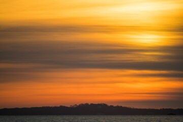 Breathtaking sunrise over the tranquil waters of Long Island Sound and Fishers Island, NY