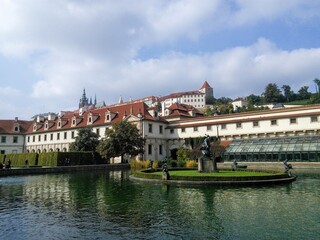 an old building that is sitting in the middle of a lake