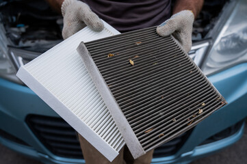 The master changes the cabin air filter of the car.
